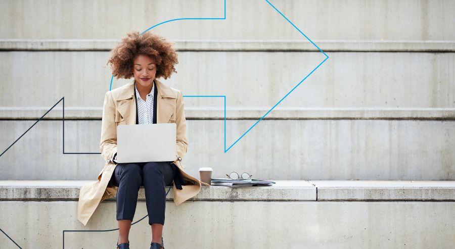 Woman on laptop in the city